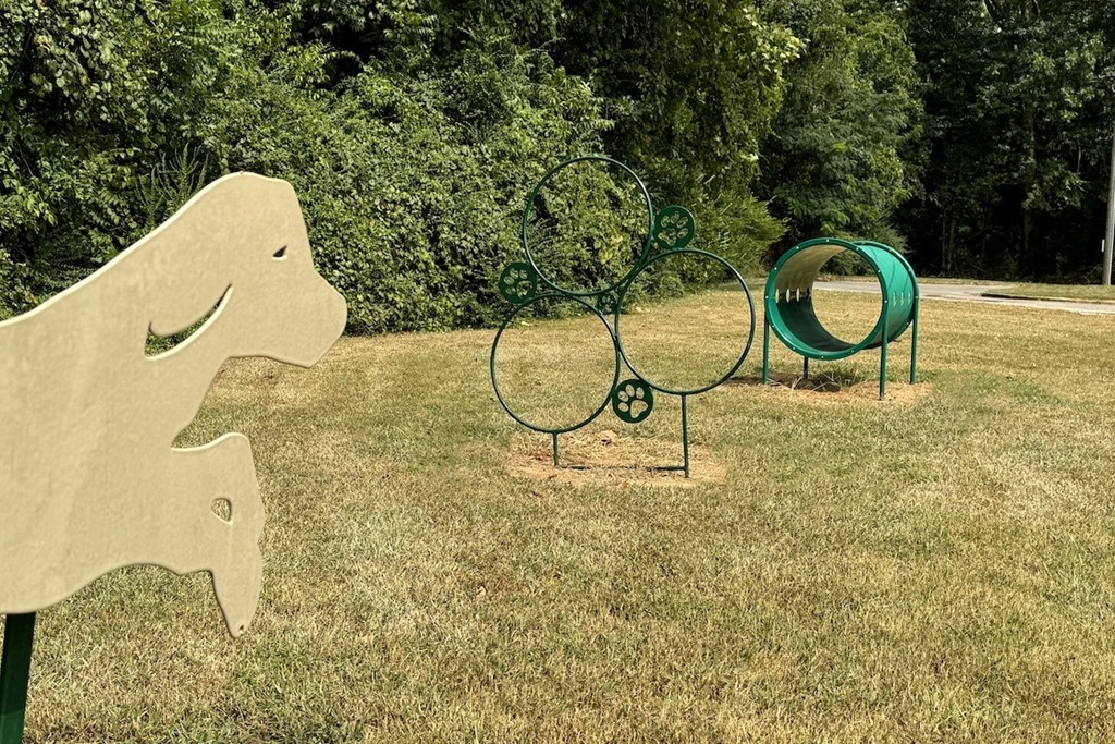 a park with a playground and a swing set a park with a playground and a swing set at Spring Lake Cove Apartments, Birmingham