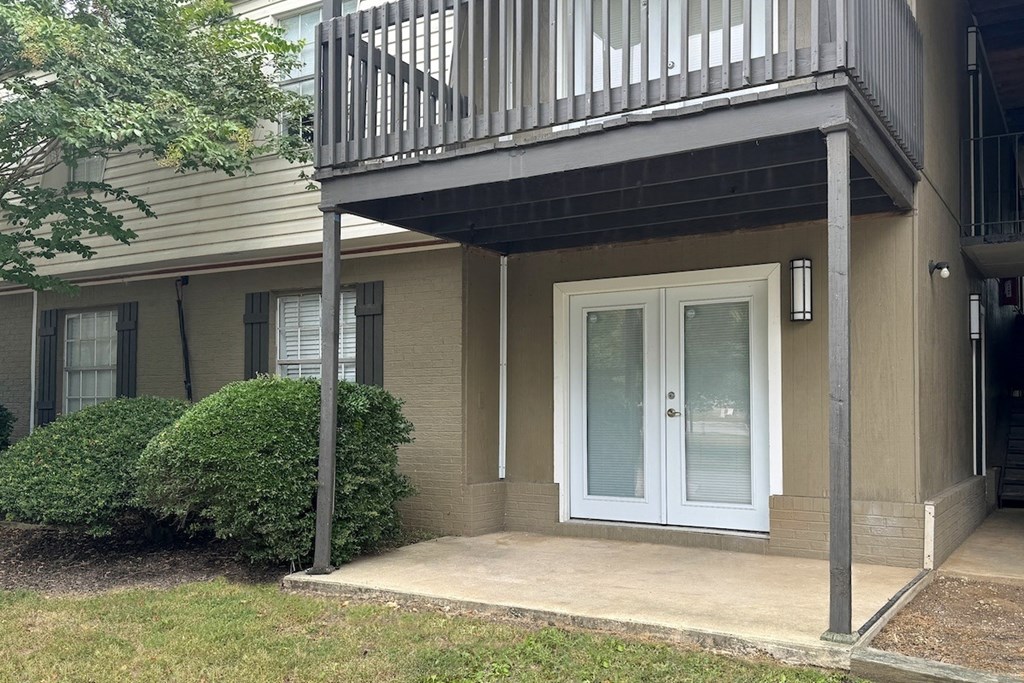 a front door of a house with a balcony a front door of a house with a balcony at Spring Lake Cove Apartments, Alabama