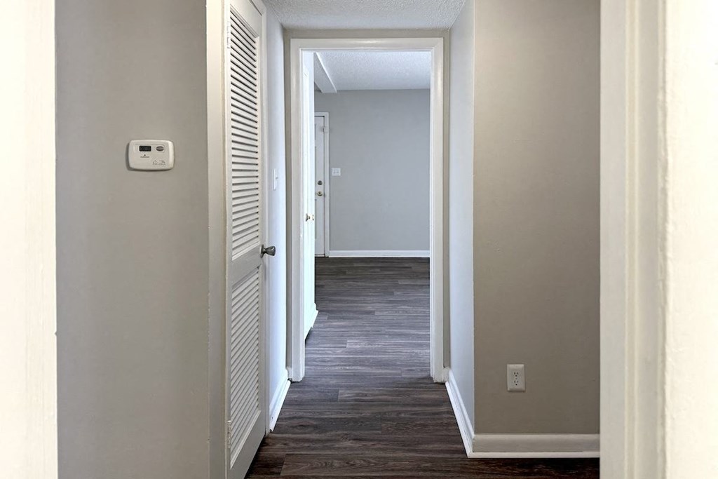 a hallway with a door and a light switch a hallway with a door and a light switch at Spring Lake Cove Apartments, Alabama, 35215