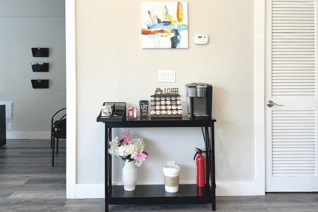 a black shelf with a coffee maker and other items on it at Spring Lake Cove Apartments, Birmingham Alabama