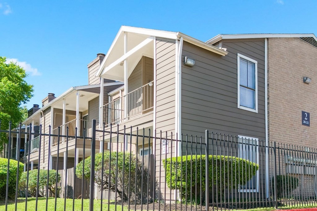 the outside of a residential building at Kirkwood Landing Apartments in Houston, TX 77099