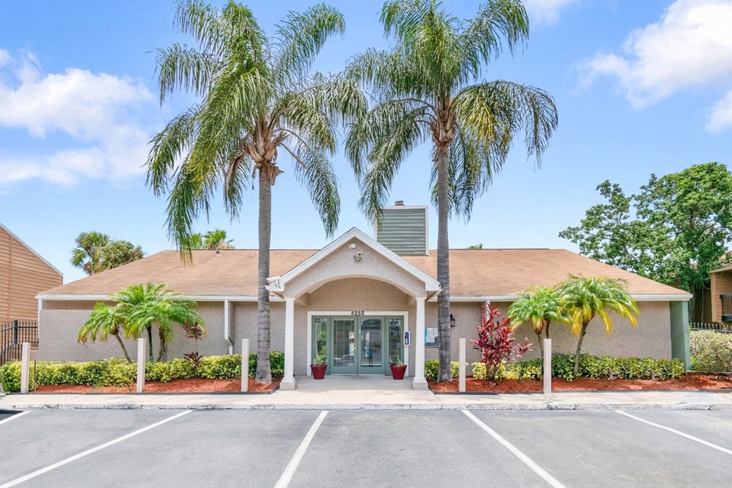 ample parking in front of the Winford Place Leasing Office with tall palm trees