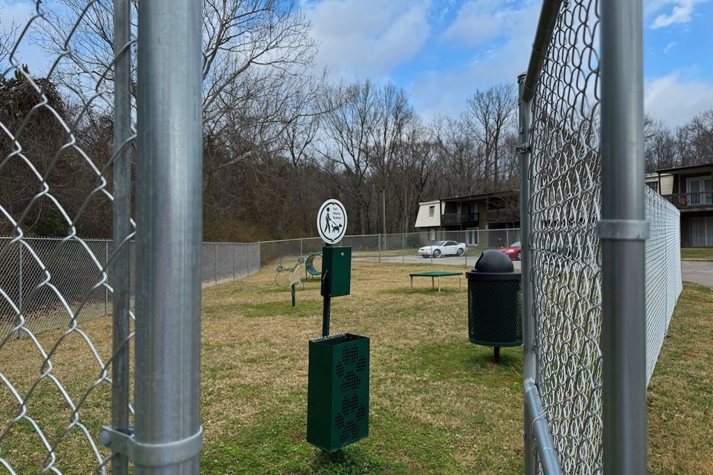 A chain link fence with a sign on it.