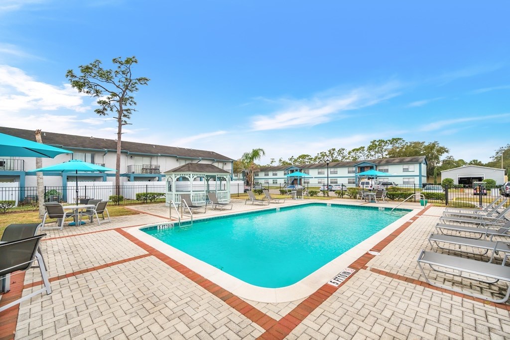 SLake-Pool_New.jpg the expansive sundeck around the swimming pool at Serenity Lake Apartments in Tamap, FL
