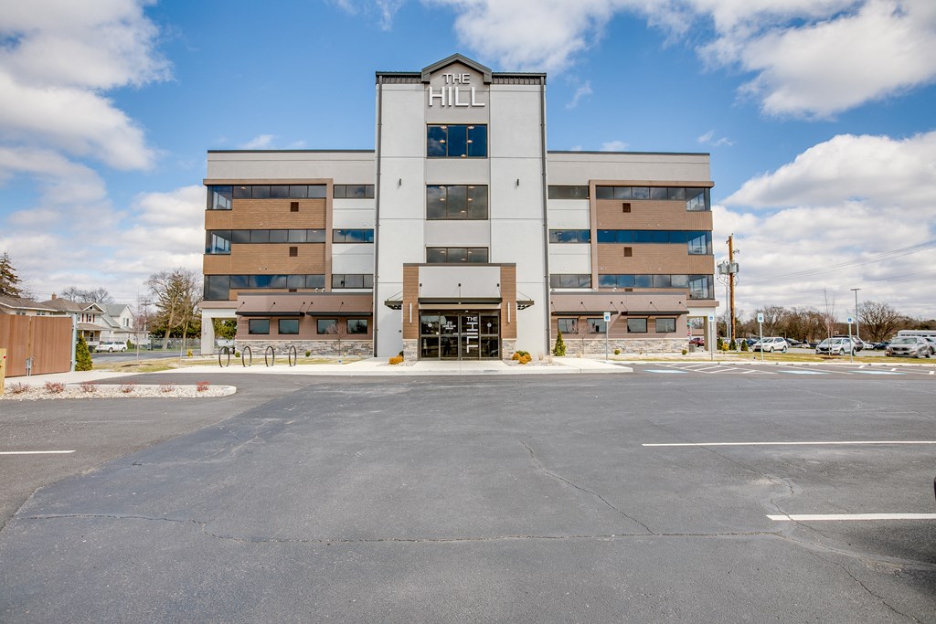 a large building with a parking lot in front of it