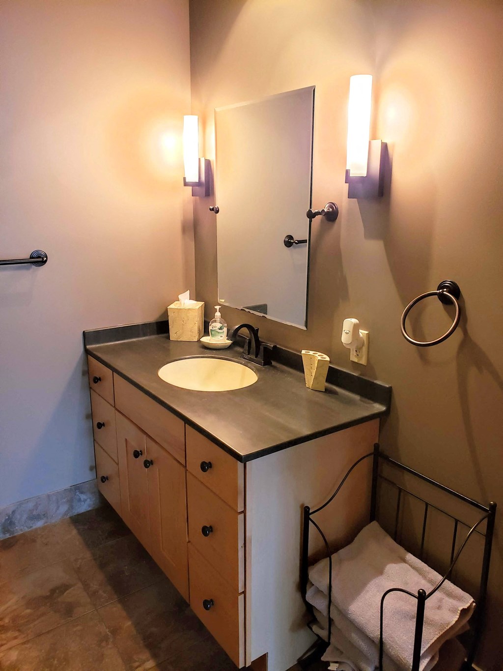 a small bathroom with a sink and a mirror
