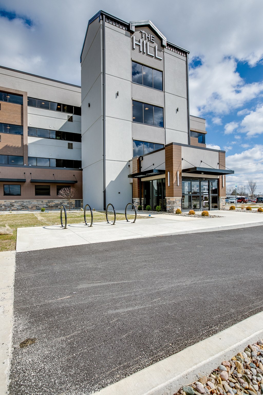 an office building with bicycle racks in front of it
