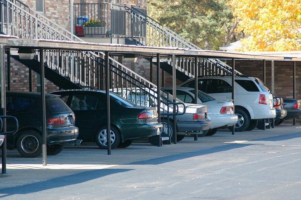 a row of cars parked in a parking lot
