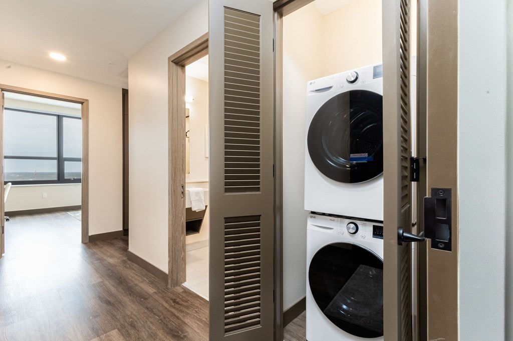 A modern laundry room with a washer and dryer.
