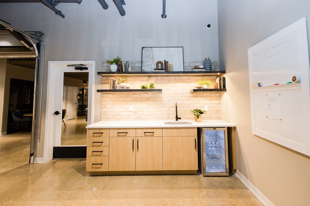a kitchen with wooden cabinets and a white counter top