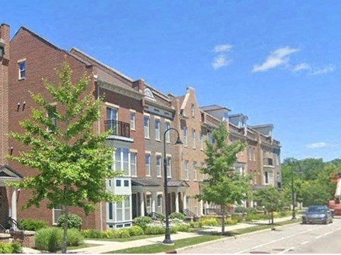 a large brick apartment building on a city street