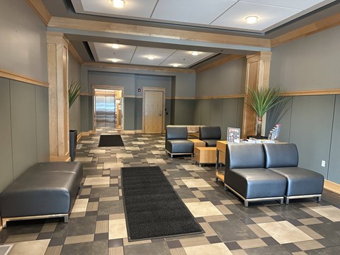 a seating area with couches and chairs