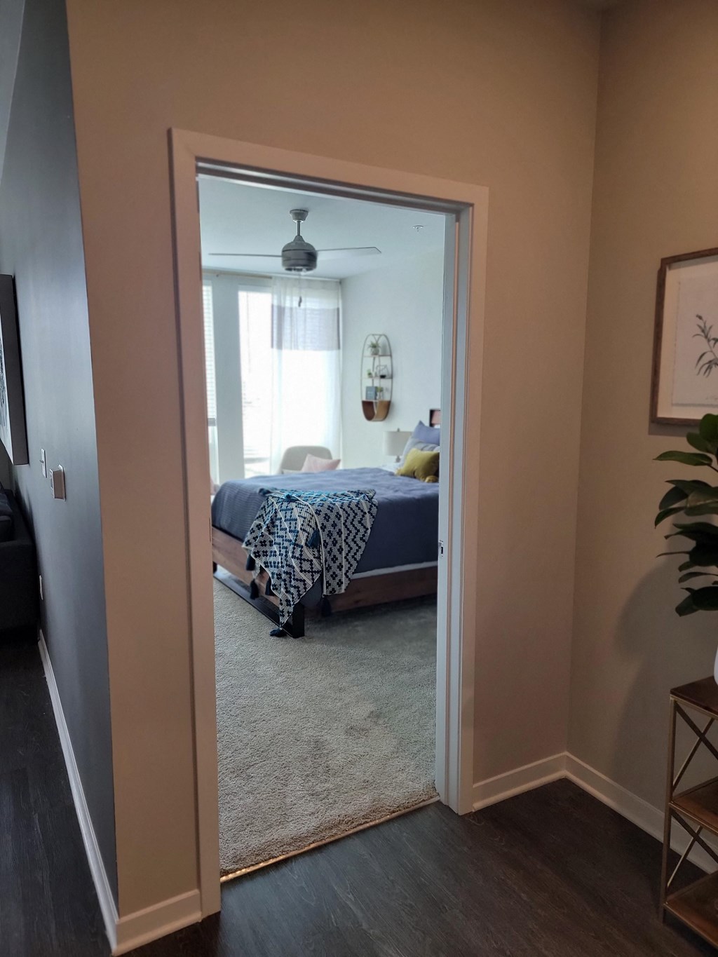 a bedroom with a bed and a door leading into it