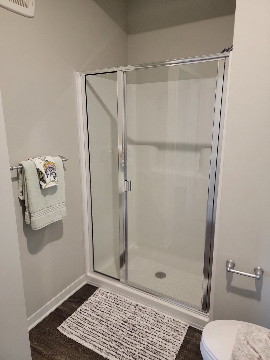 a small bathroom with a shower and a toilet