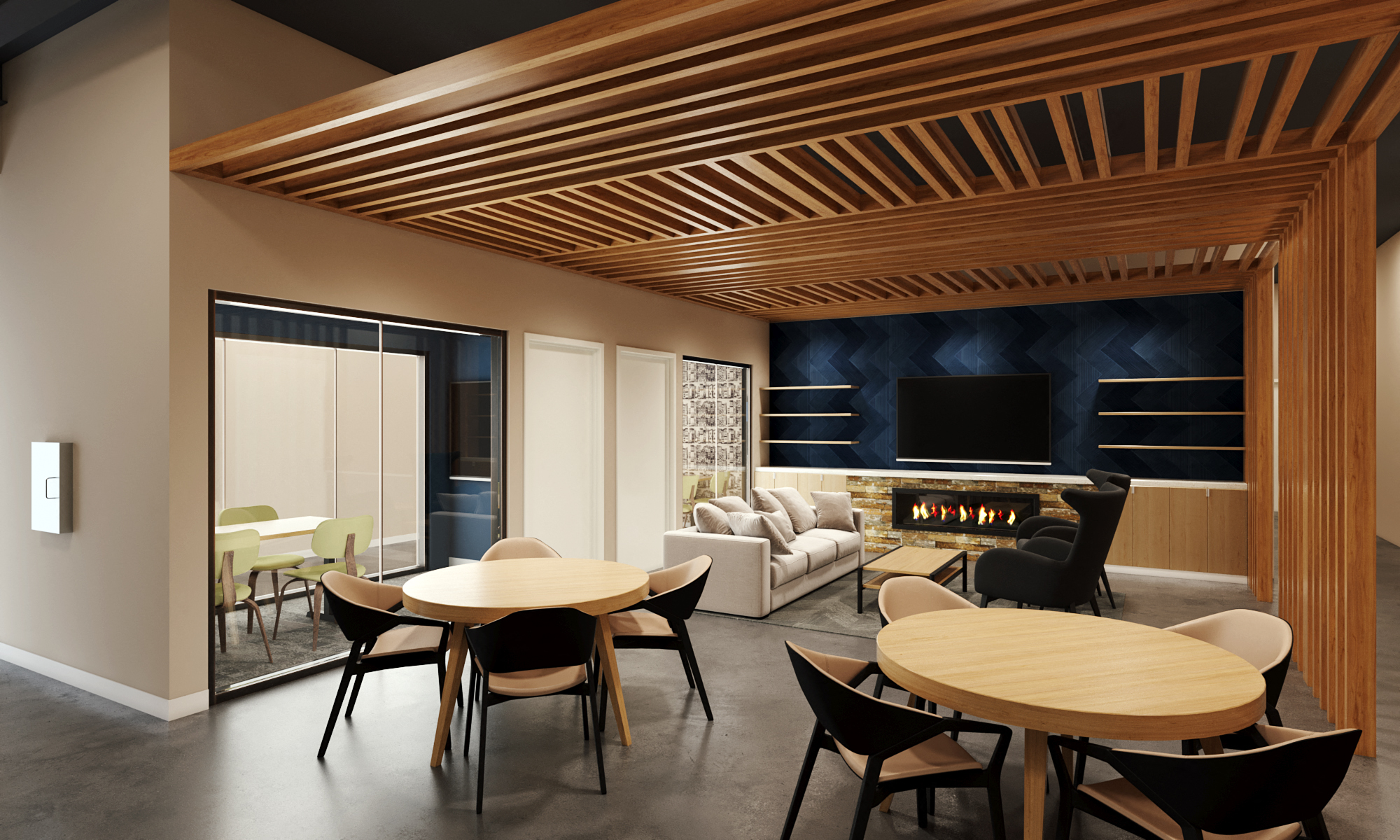 Lounge area with tables chairs and a fireplace at The Hill apartments in South Bend Indiana