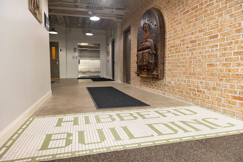 a brick wall with a mural and a carpet with the words affordable ball dodgers