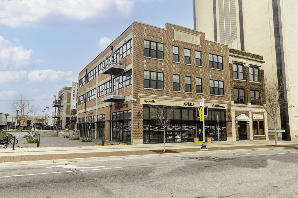 a brick building on the corner of a city street