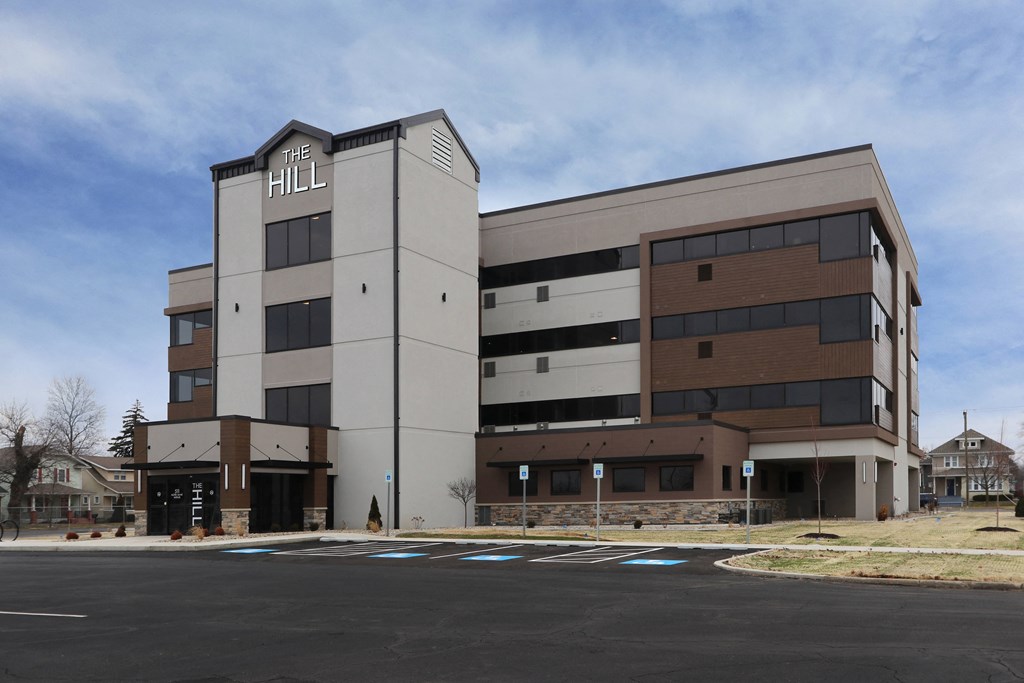 an office building with a blue sky in the background