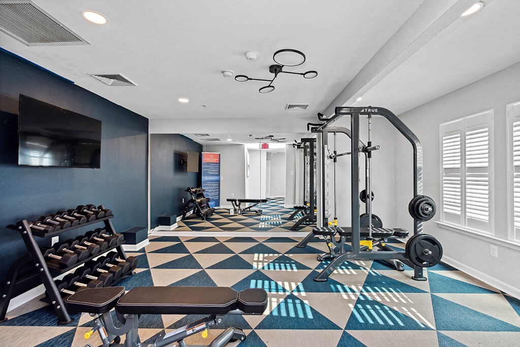 Fitness center weights at England Run Apartments in Fredericksburg VA