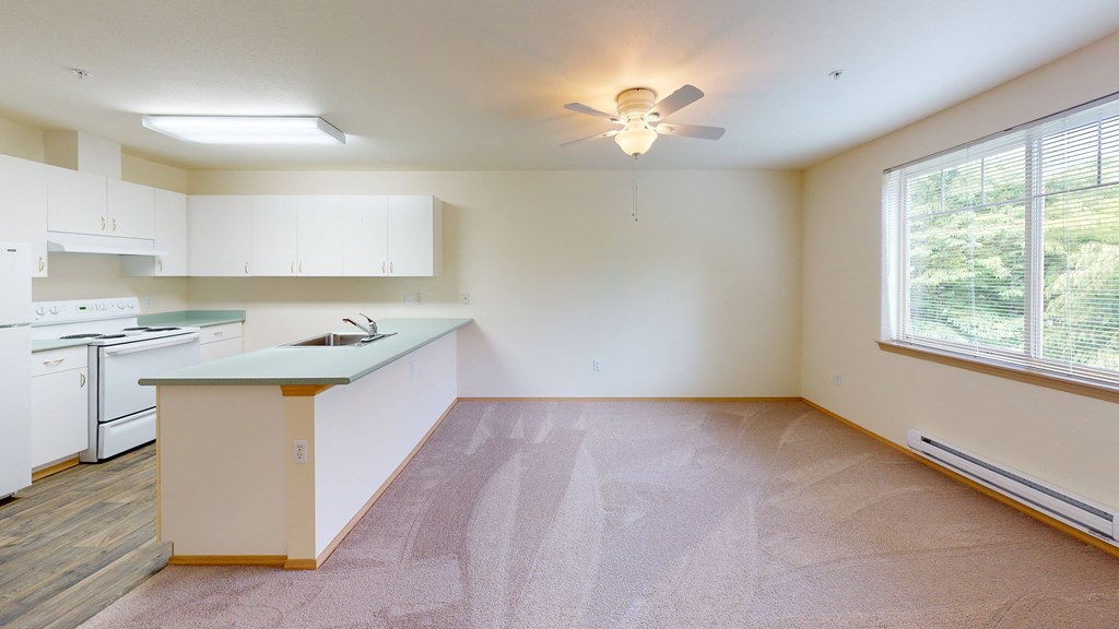 Kitchen with living room space at Alderwood Court in Lynnwood WA
