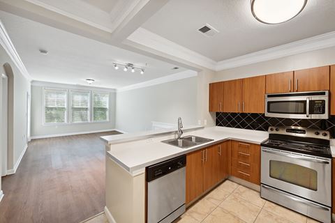 Kitchen with view of living room at Westerchester at the Pavillions in Waldorf MD