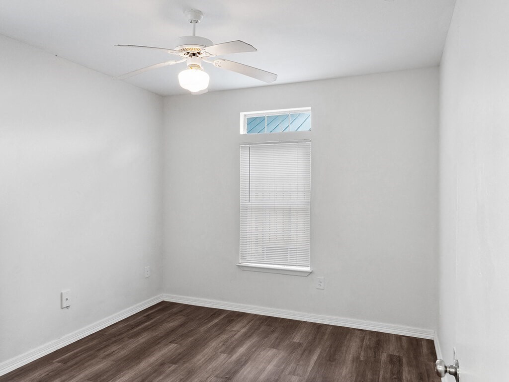Bedroom with ceiling fan at Tidwell Estates in Houston TX