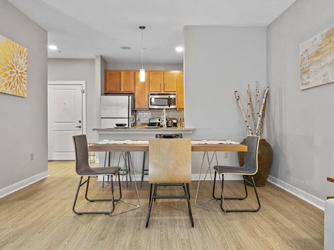 a kitchen and dining room with a table and chairs