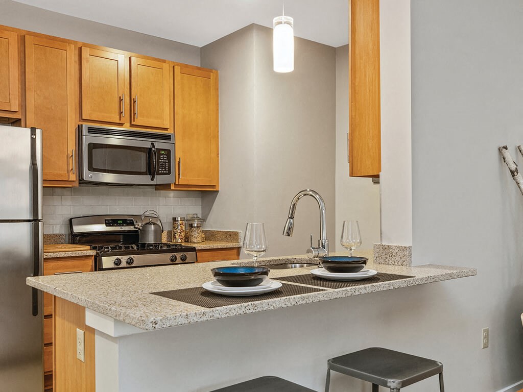 Kitchen seating at Axis Admirals Hill Apartments in Chelsea MA