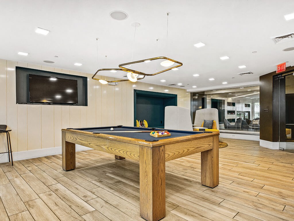 Game area at Axis Admirals Hill Apartments in Chelsea MA