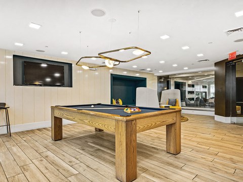 Game area at Axis Admirals Hill Apartments in Chelsea MA