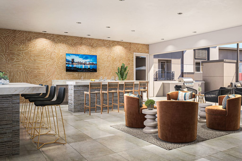 a lobby with a bar and chairs and a flat screen tv on the wall