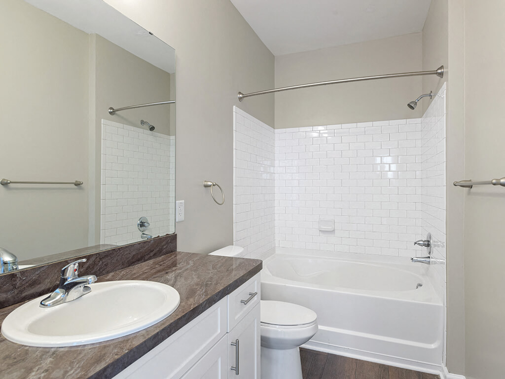 Bathroom sink and tub at Falls Pointe Apartments in Durham NC