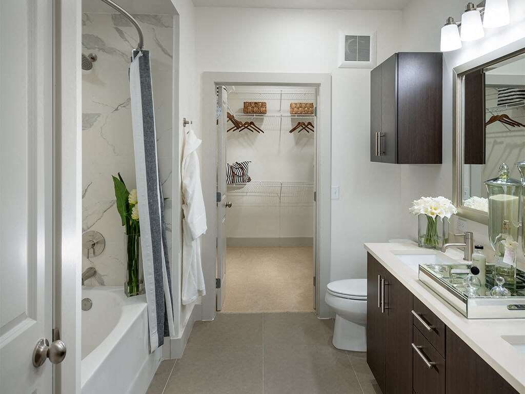 Bathroom with attached closet at Cirro King of Prussia Apartments in King of Prussia PA