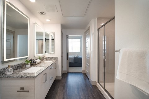 Bathroom attached to bedroom at District at Scottsdale Apartments in Scottsdale AZ