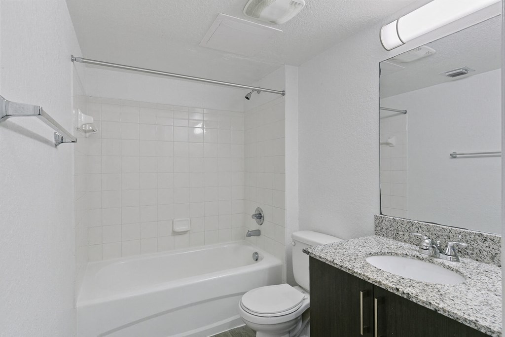 Bathroom with shower tub at Brenton at Abbey Park Apartments in West Palm Beach FL