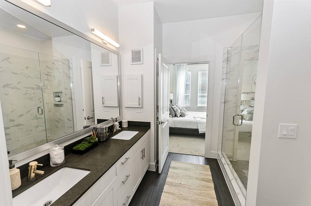 Bathroom with dual sinks at Opal Legacy Central in Plano TX