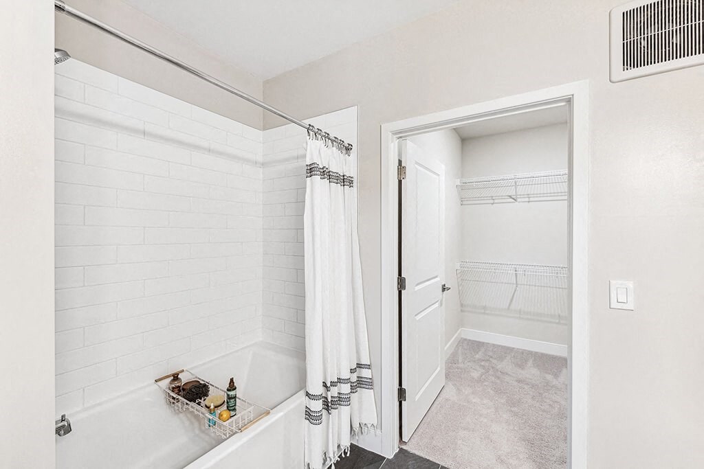 Bathroom with attached closet at The Moxley in Fairfax VA