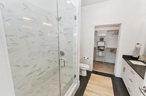 Bathroom with shower glass enclosure at Opal Legacy Central in Plano TX