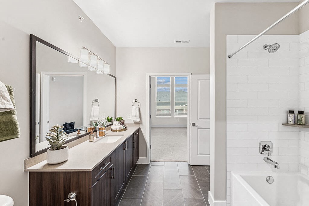 Bathroom with shower and tubat The Moxley in Fairfax VA