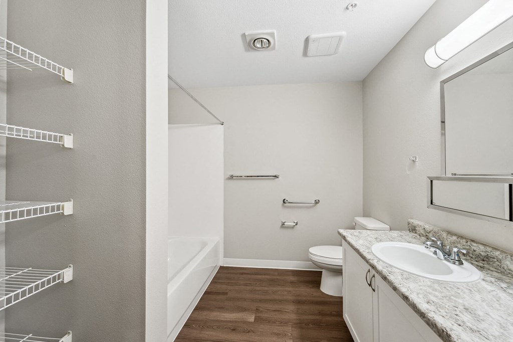 Bathroom with storage at Auburn Court Apartments in Auburn WA