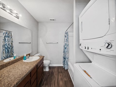Bathroom with laundry at Forest Creek Apartments in Houston TX