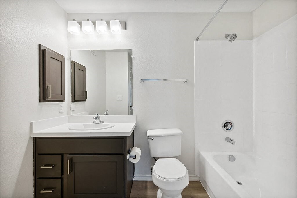 Bathroom with kitchen and toilet at Bonito Parque Apartments in San Antonio TX