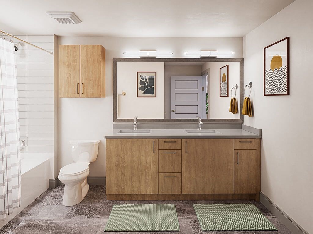 Bathroom with dual sinks at Treo Apartments in Fort Lauderdale FL