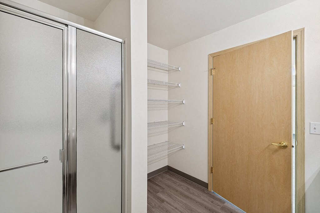 a walk in closet in a 555 waverly unit