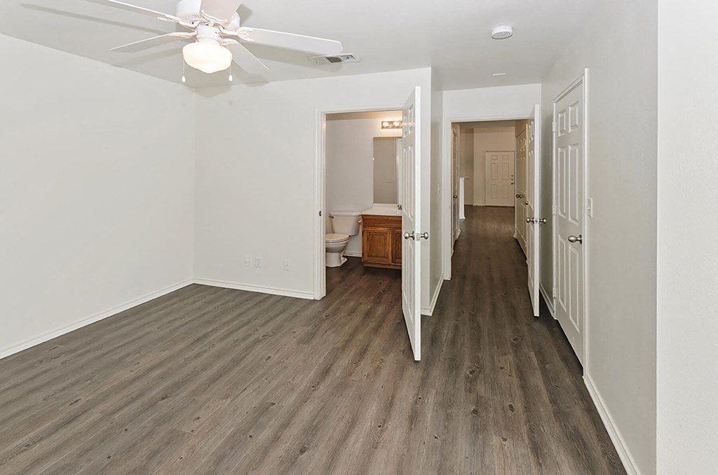 Spacious bedroom with attached bathroom at Cypress View Villas Apartments in Weatherford TX