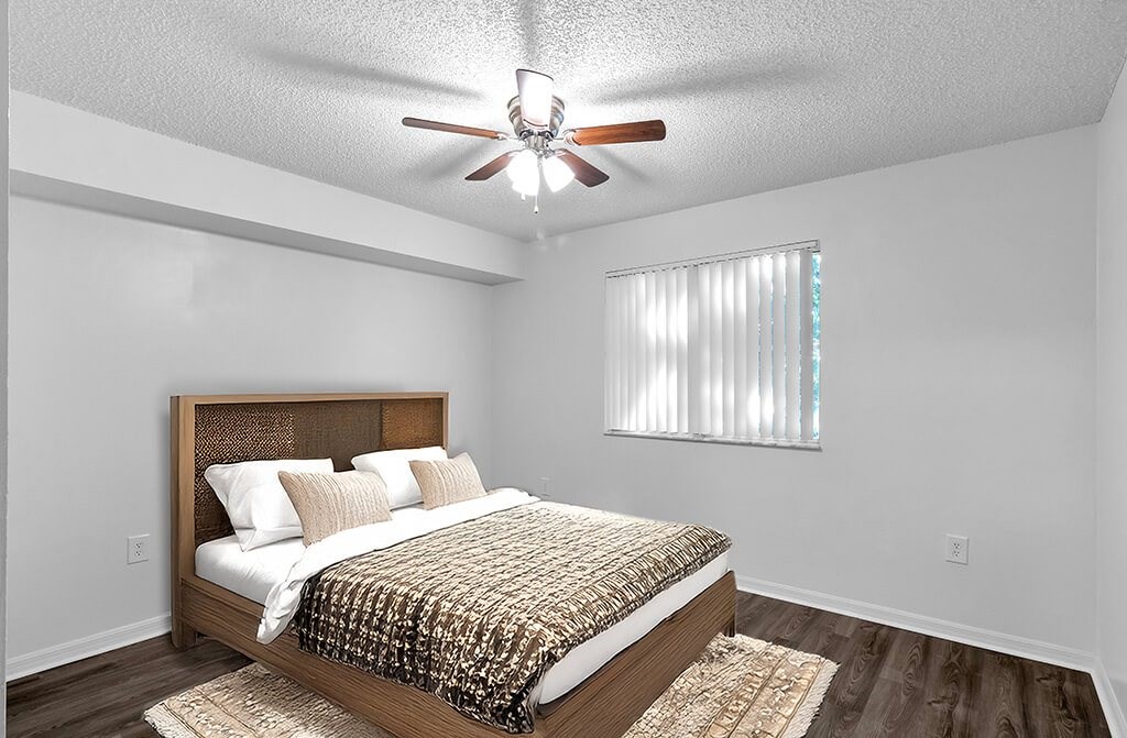 Bedroom with ceiling fan at Cedar Grove Apartments in Miami FL