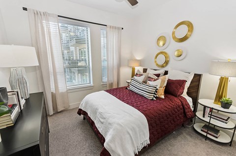 Bedroom with large window at Opal Legacy Central in Plano TX