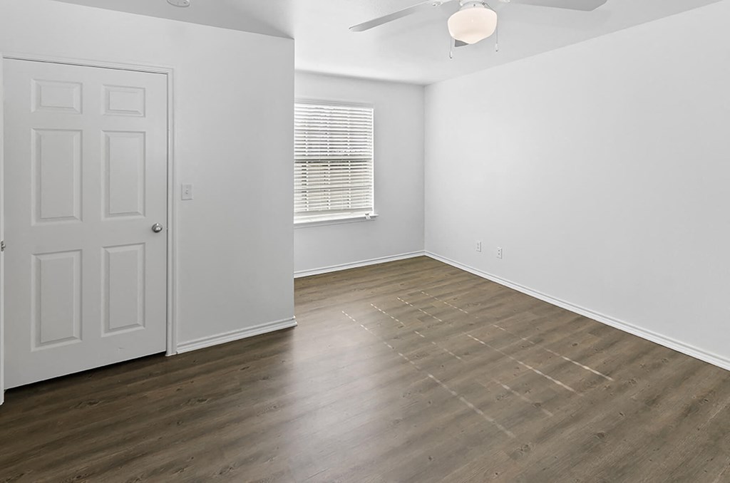 Bedroom with ceiling fan at Cypress View Villas Apartments in Weatherford TX