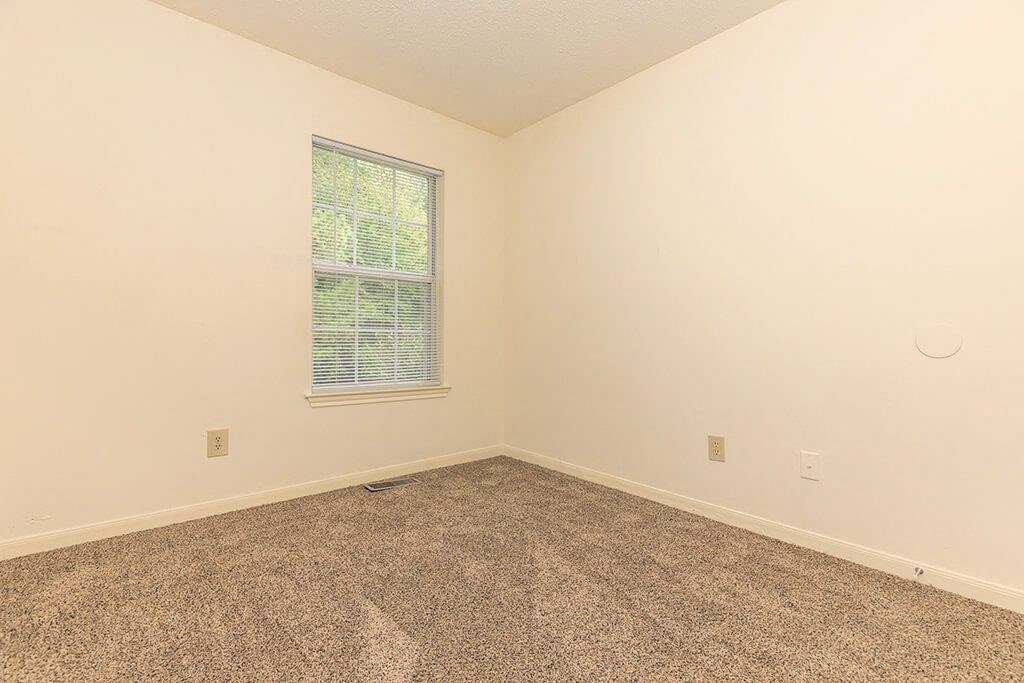 Bedroom with window at Greens of Pine Glen in Durham NC