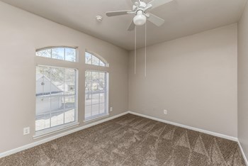 Bedroom with large window at Hollow Creek in Conroe TX - Photo Gallery 6